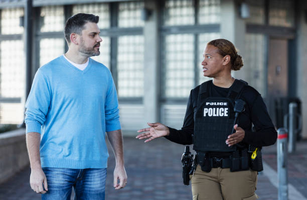 istock Policewoman talking to man 2156271888