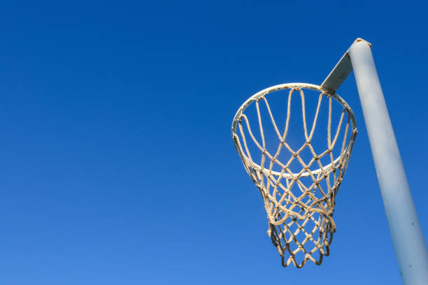 istock netball hoop against blue sky 2156272775