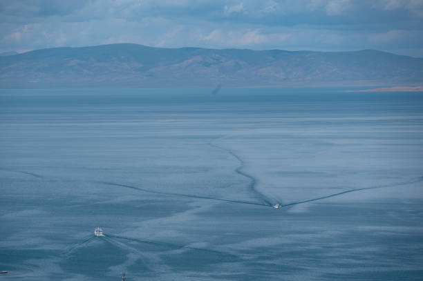 The lake under clear weather and the distant mountains