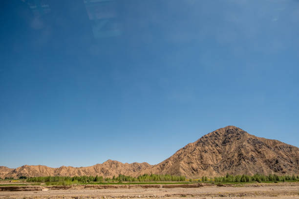 The fields and mountains on the plateau under clear weather