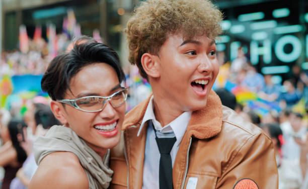istock Two friend celebrating in pride parade 2156278055