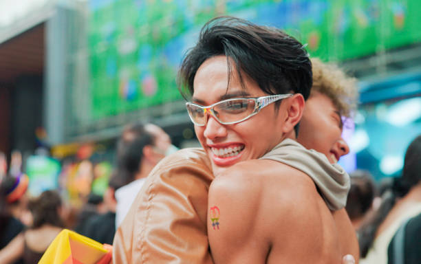 istock Two friend celebrating in pride parade 2156278070