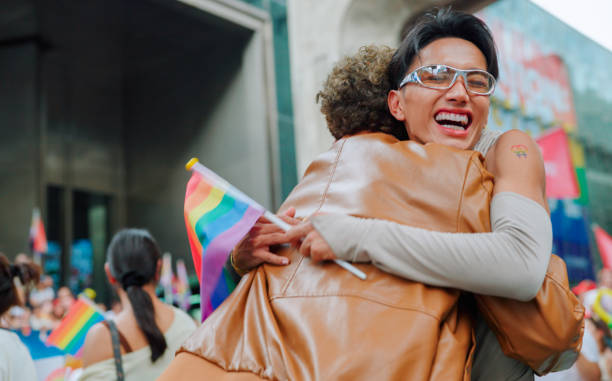 Two friend celebrating in pride parade