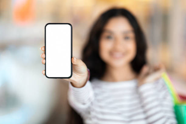 istock Phone with white empty screen in woman hand 2156283347