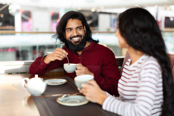 istock Cheerful young indian man enjoying date with his girlfriend 2156283431
