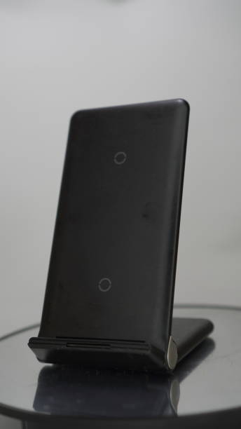istock wireless charger device has a black charger 2156283793