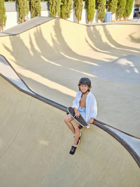 istock Boy with longboard in skate park 2156284026