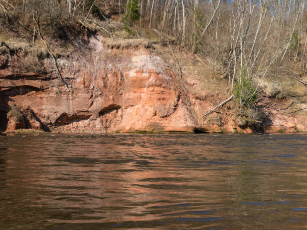 istock charming spring landscape with sandstone cliffs on the river bank, fast flowing and clear river water 2156292020
