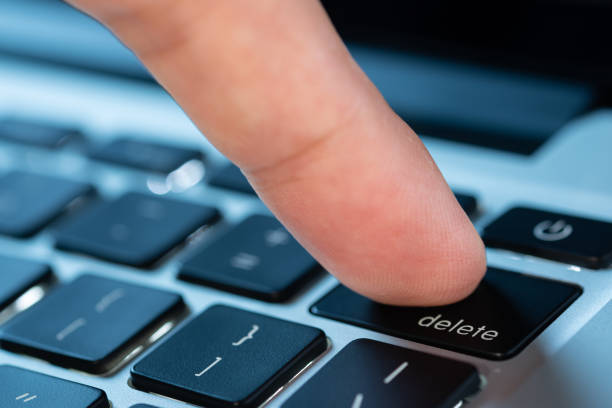 istock Finger of the computer user, he presses the delete button on the computer keyboard. 2156293201