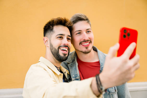 istock young couple making a video call outside 2156294760