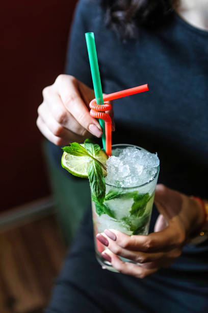 istock Woman Holding Mojito Cocktail 2156297142