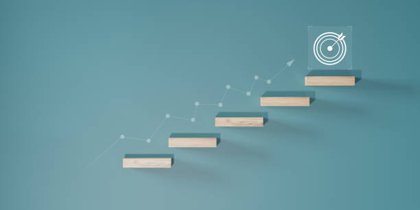 istock Growth or increase design concept. Cube block staircase moving step growing up to target. Success achievement or goal business motivation. 2156297150