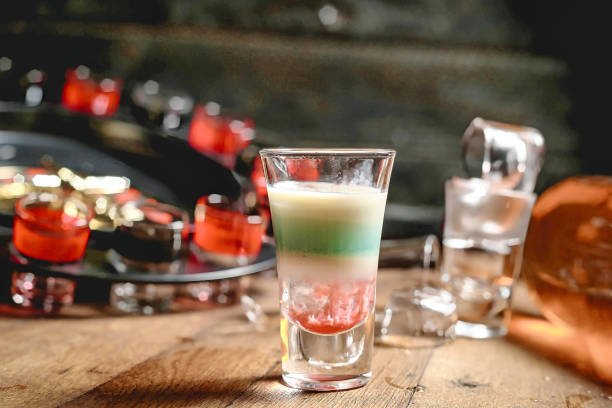 istock Wooden Table With Glasses of Liquid 2156298980