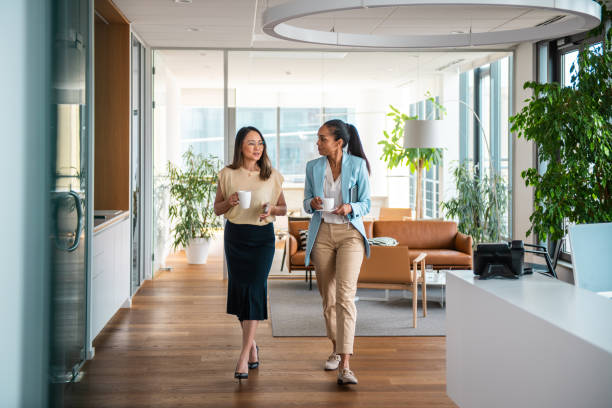 istock Professional Interaction Between Diverse Businesswomen in Office Setting 2156299175