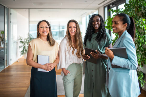 Diverse Businesswomen Team Smiling in Modern Office