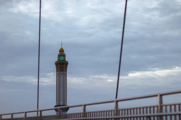 The tall clock tower in the city is iconic