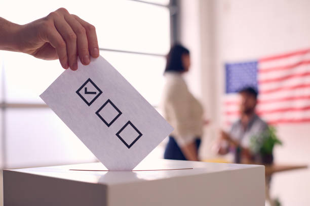 istock Person Casting Ballot in Election 2156303177