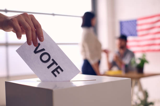 istock Person Casting Vote In Election Ballot Box 2156303183