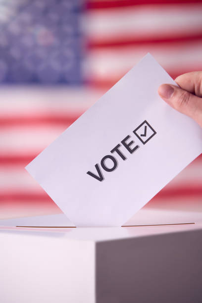 istock Ballot Being Cast in Front of American Flag 2156303304