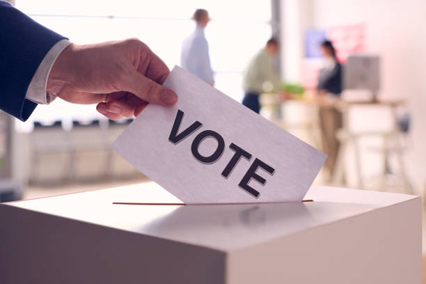 istock Person Casting Ballot in Election 2156303491