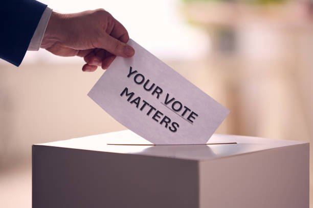 istock Person Casting Ballot With Your Vote Matters Message 2156304051