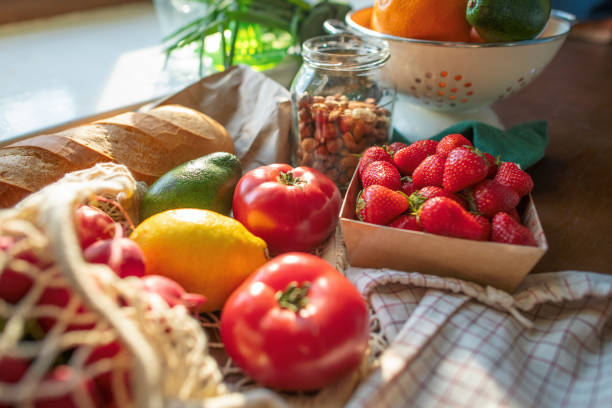 istock Reusable shopping bag with fruit and vegetables at a kitchen 2156304778