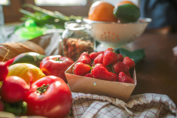 istock Reusable shopping bag with fruit and vegetables at a kitchen 2156304782