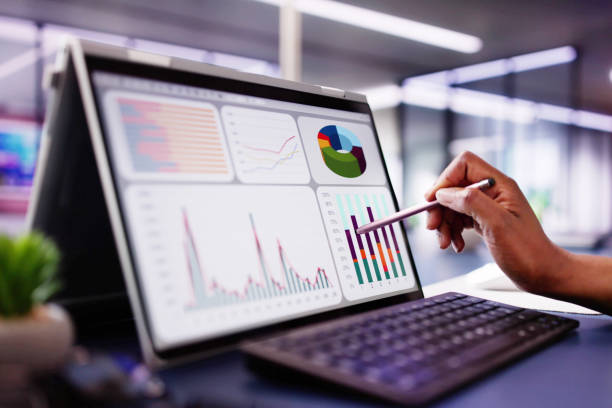 istock African American woman analyzing financial data on laptop screen in hybrid office setting 2156306550