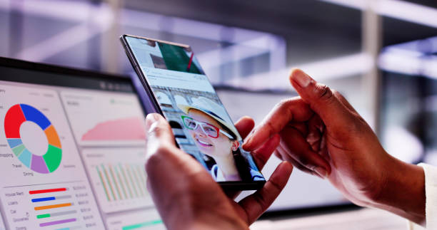 istock Social media entrepreneur matches users on dating app while holding smartphone 2156308003