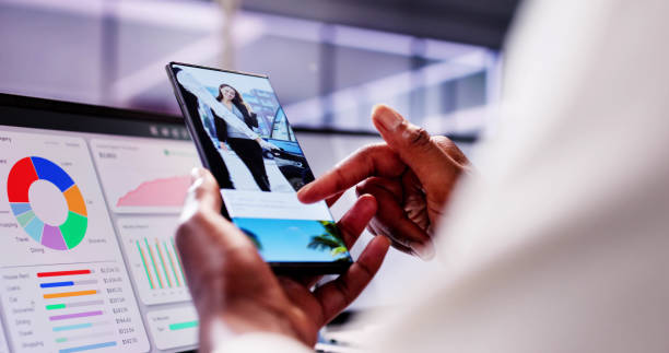istock Social media entrepreneur matches users on dating app while holding smartphone 2156308069