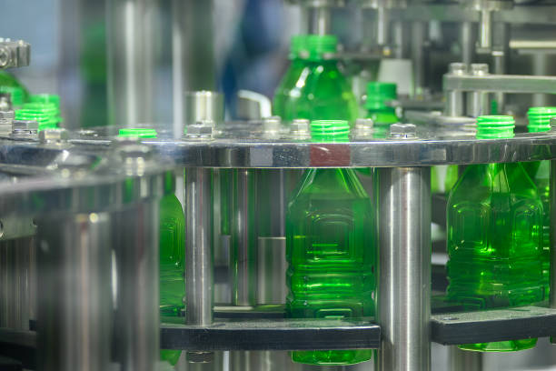 istock The  empty green  bottles on the conveyor belt for filling process. 2156310711