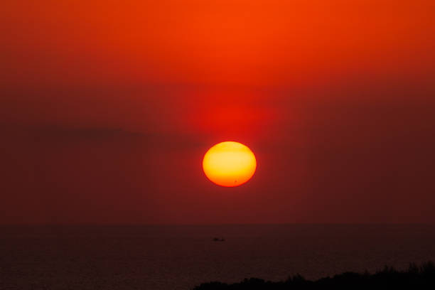 Amazing view on sunrise sun and clouds.