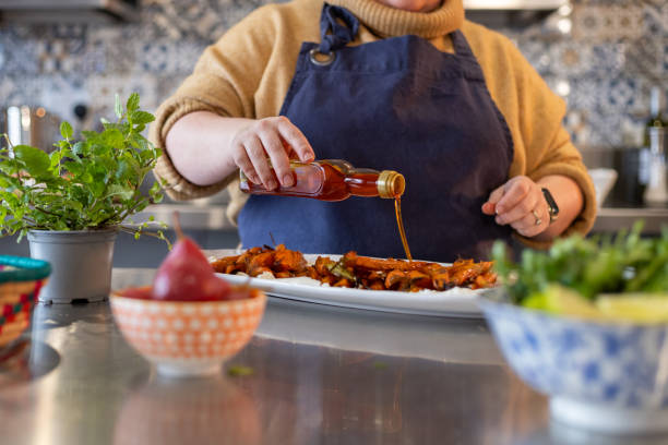 istock Drizzling Olive Oil Over Roasted Carrots 2156312985