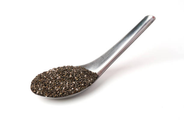 istock Chia Seed on spoon isolated on white background. Chia Seed is a small grain. will swell when soaked in water. high energy. many nutrients Contains omega-3, protein, fiber,  antioxidants and vitamin. 2156321373