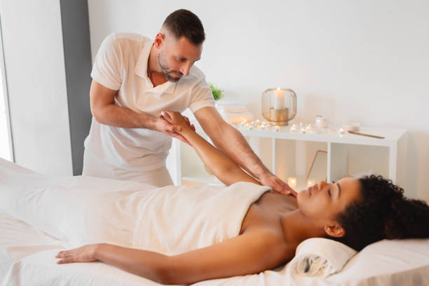 istock Professional masseur giving a body massage at spa 2156323522