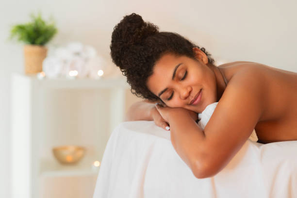 istock Woman hugging a pillow on a massage table 2156323538