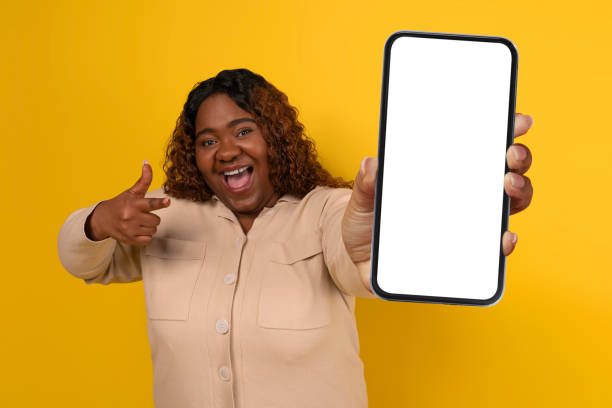 istock Chubby Black Woman Showing Big Smartphone With White Blank Screen 2156324221
