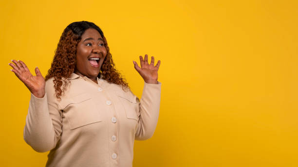 istock Amazed chubby black woman looking at copy space 2156324256