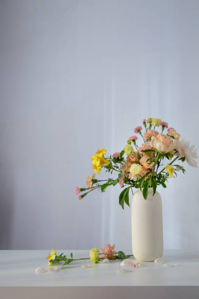 istock beautiful bouquet in white vase in sunlight 2156325005
