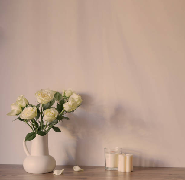 istock white roses in white jug in white interior 2156325165