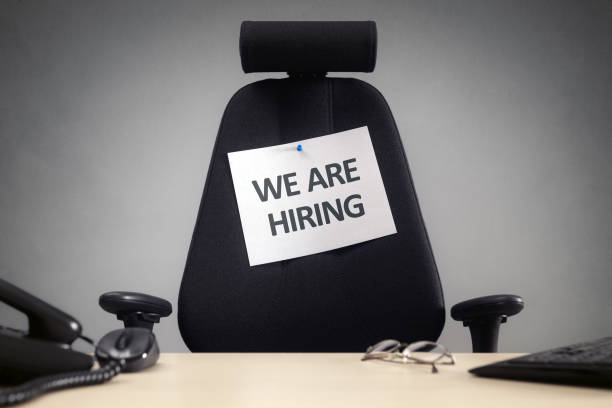 istock We are hiring sign on empty office chair 2156325198