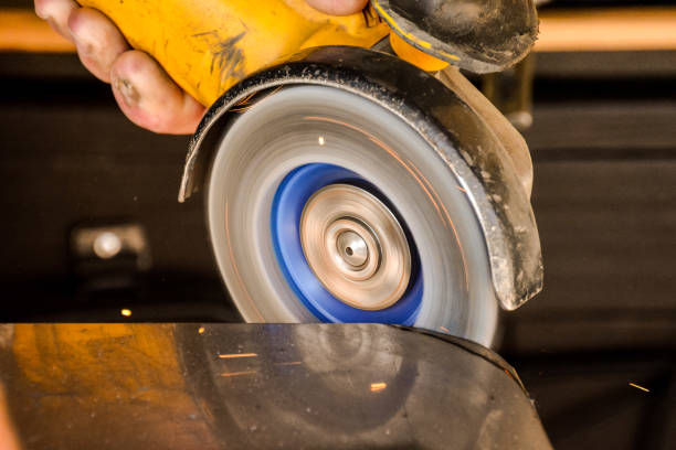 istock Cutting steel with angle grinder at car service 2156328830