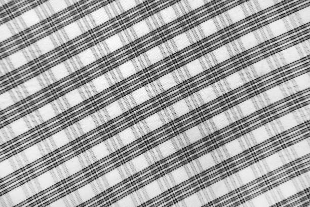istock Checked fabric tartan black and white  textured background 2156330273