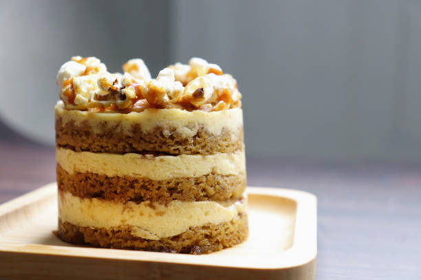 istock Assorted Seasonal mini cakes. Hazelnut, Opera, Salted Caramel, and Double Chocolate. Endless variety, easy serving, moist layers, rich frosting. A symphony of flavor in every bite. Bakery products. 2156330610