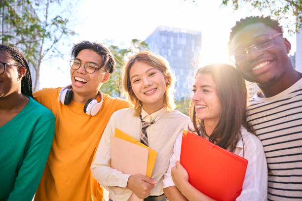istock Asian young student woman posing smiling looking at camera, multiracial classmates on campus. 2156330766