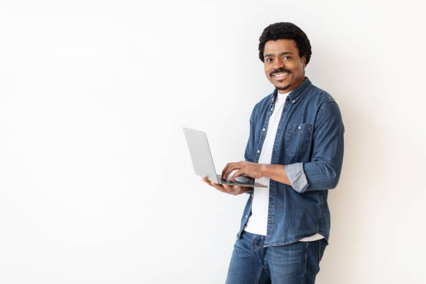 istock Man Standing With Laptop in Hands on White 2156332490