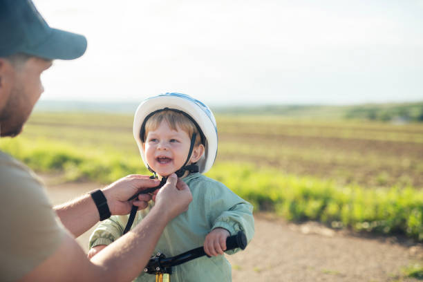 istock Dad prepared his toddler for a bicycle ride. 2156335392