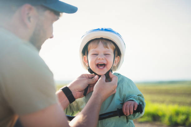 istock Dad prepared his toddler for a bicycle ride. 2156335397