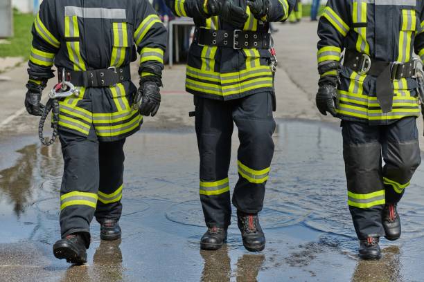 istock A team of confident and accomplished firefighters strides purposefully in their uniforms, exuding pride and satisfaction after successfully completing a challenging firefighting mission 2156340870