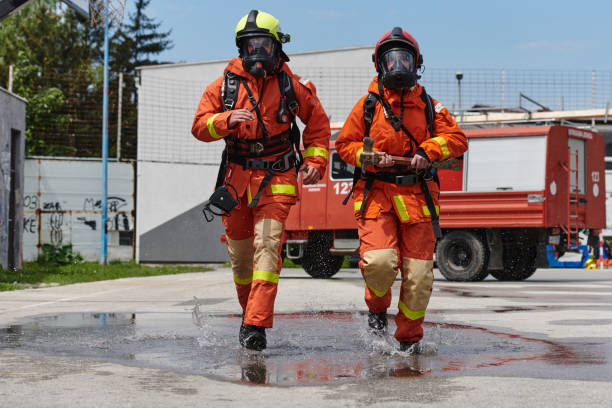 istock A team of confident and accomplished firefighters strides purposefully in their uniforms, exuding pride and satisfaction after successfully completing a challenging firefighting mission 2156342429